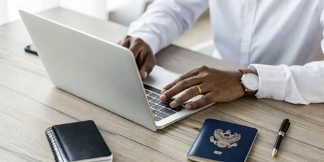 Man completing an online application for his Indian passport.
